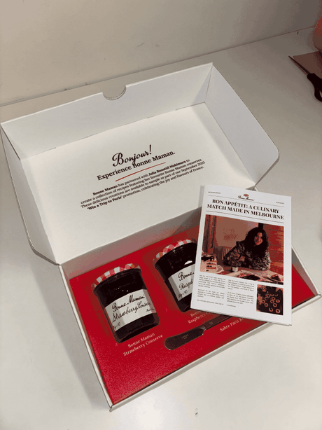 custom ecommerce packaging with 3 jams and a newspaper