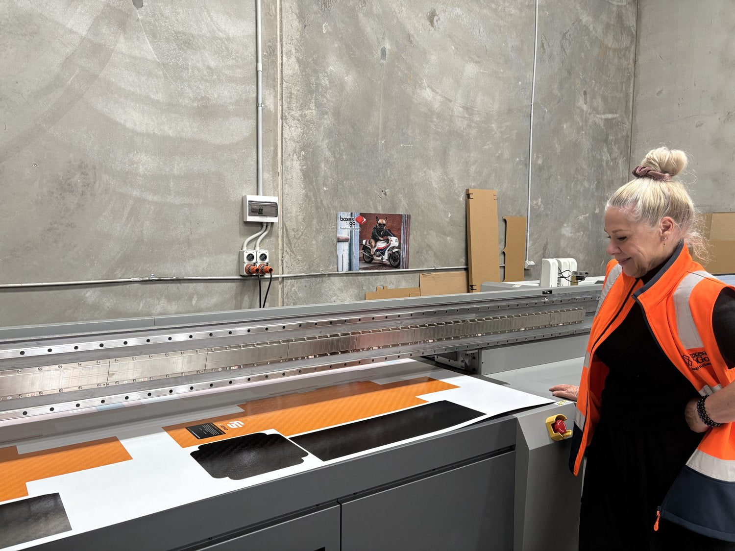 Jo Allan, co-owner, at the flatbed printer in the Derrimut factory